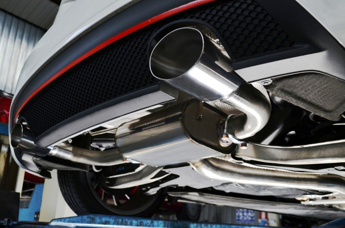 Exhaust tailpipe on a vehicle raised on a shop lift