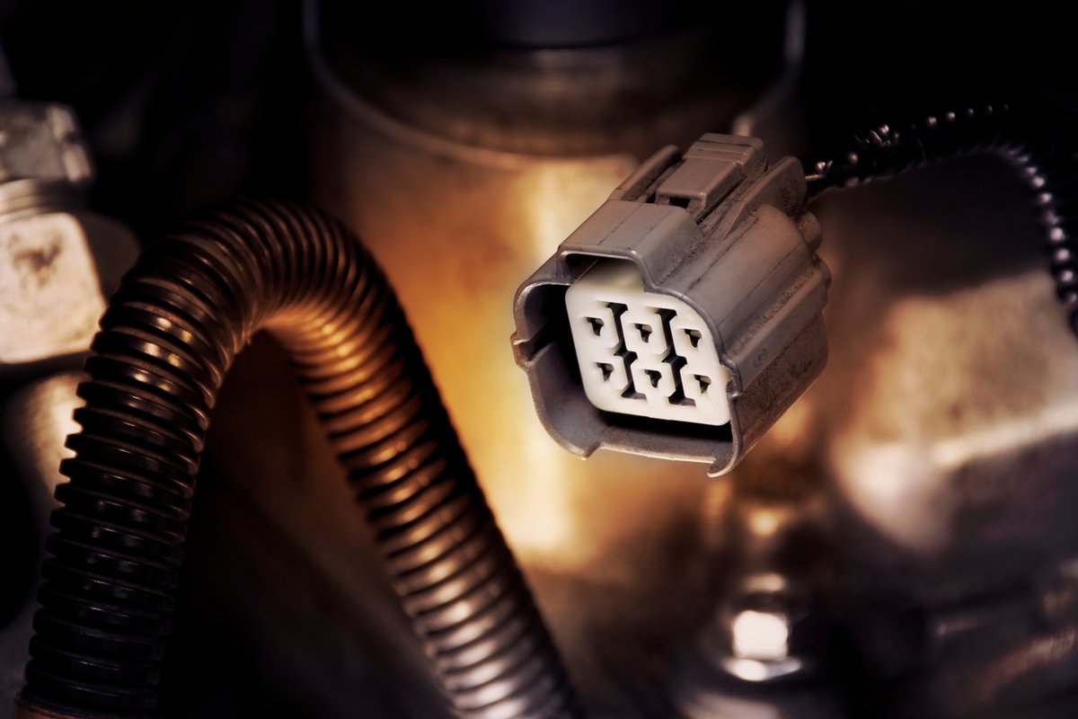 Oxygen sensor connector attached to a vehicle's exhaust system