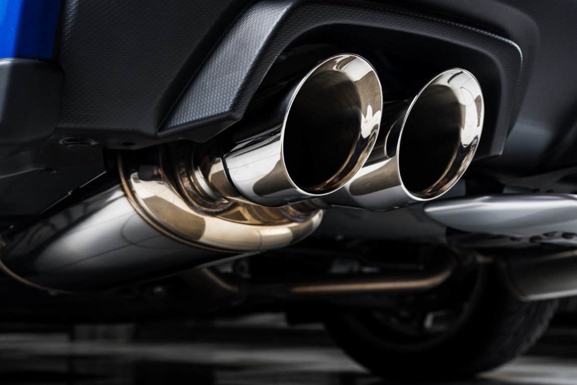 Polished dual chrome exhaust tips on a performance exhaust system